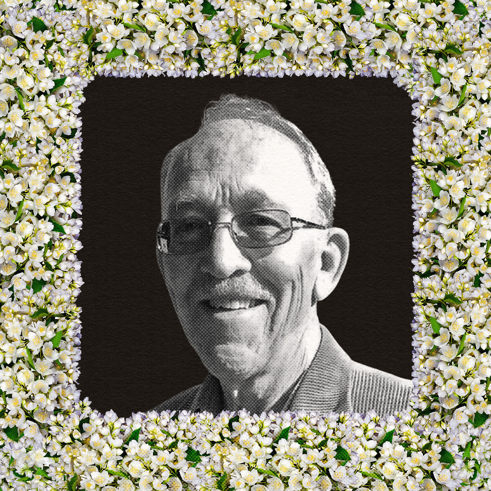 A portrait of a man surrounded by flowers.