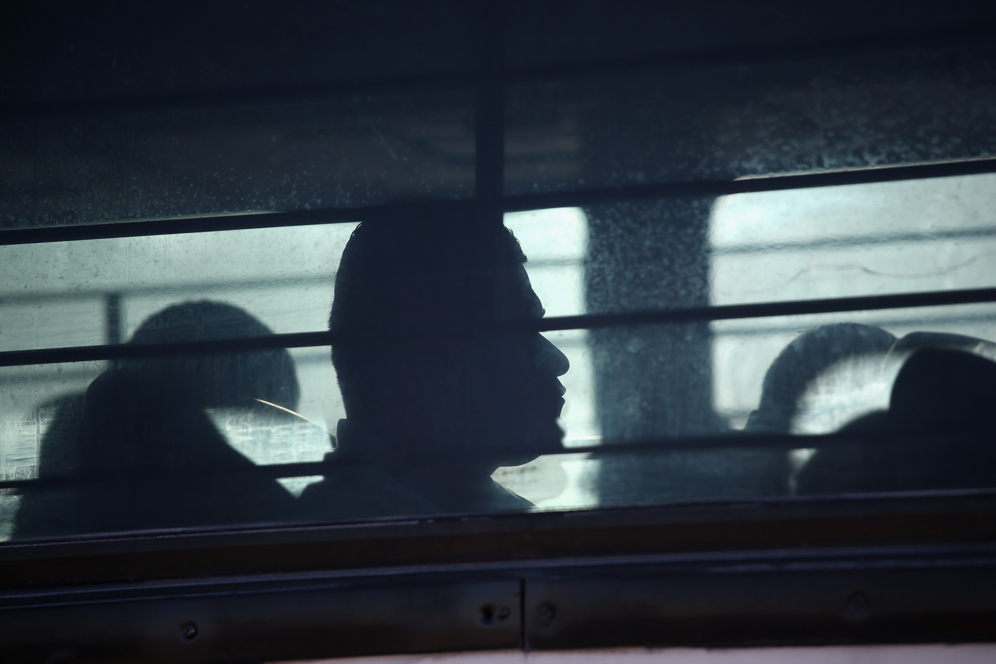 Shadow of detained migrant