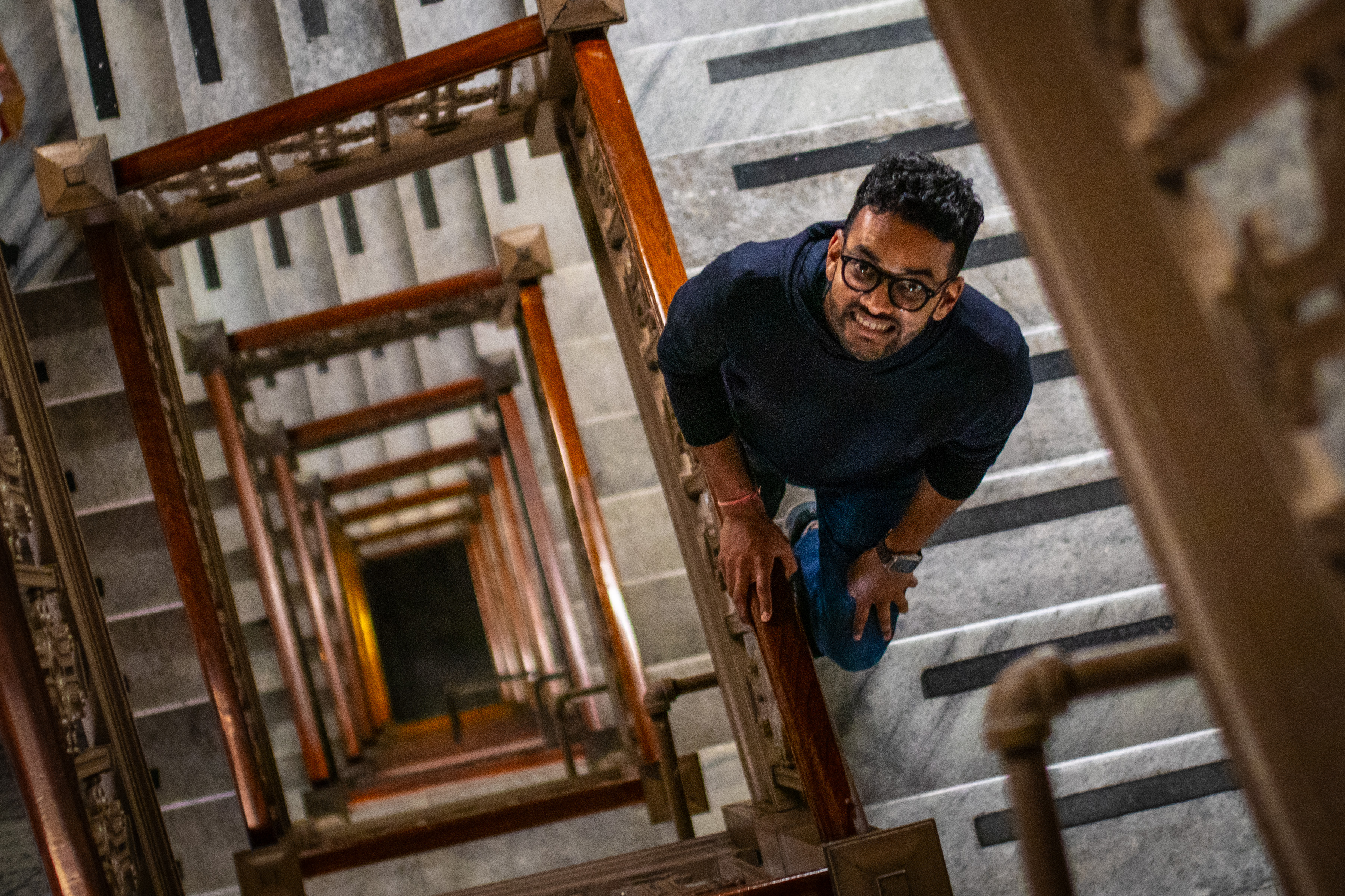 Notion co-founder and Chief Operating Officer Akshay Kothari scales a marble staircase inside Notion's new headquarters in San Francisco on Thursday, June 5, 2025. The emerging AI giant has signed a 10-year direct deal for five floors of the century-old building.