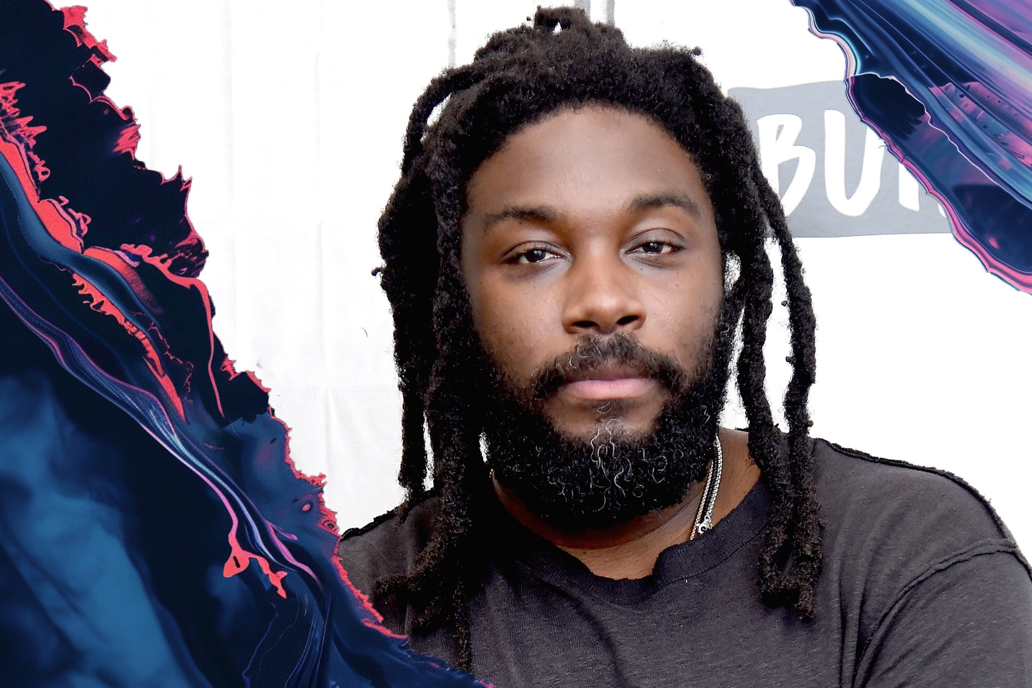 The image features a person with dreadlocks and a beard wearing a dark shirt, set against a vibrant, abstract background with swirling colors.
