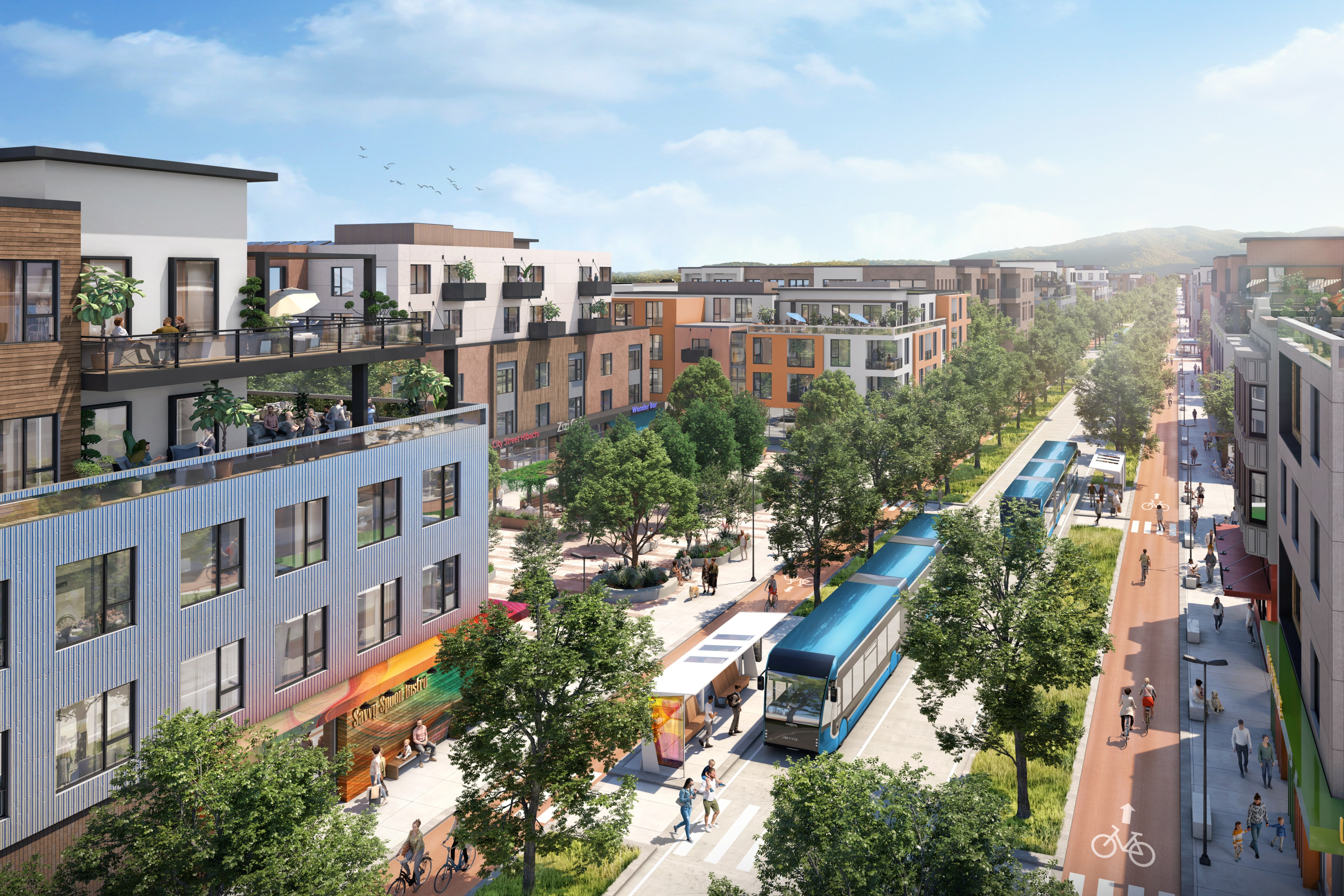 The image shows a modern urban street lined with trees and low-rise buildings. There's a blue tram in the center and people walking and cycling along the sidewalks.